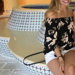 Off the shoulder black and pink floral shirt